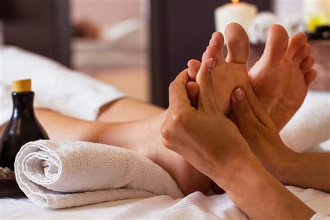 Massage Of Human Foot In Spa Salon Soft Focus Courtyard Clinic
