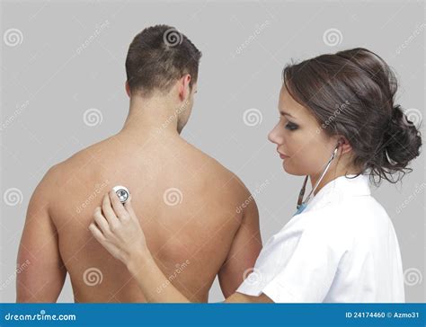 Young Female Doctor Examining A Male Patient Royalty Free Stock Image