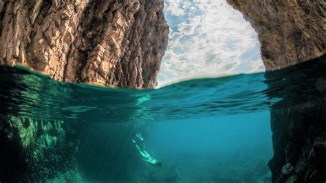 scuba diving under ocean cave hd wallpaper background image 1920x1080 id 893256