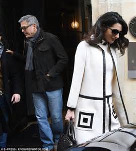 pregnant amal clooney and george leave their paris hotel