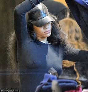 rihanna in blue coat and furry boots as she arrives in london daily mail online