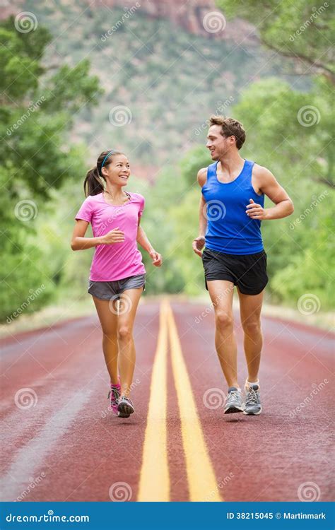 people jogging  fitness running  road royalty  stock photo