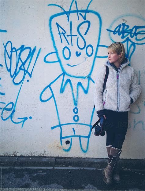 woman camera graffiti by helen rushbrook stocksy united