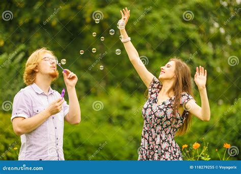 Couple Blowing Bubbles Outdoor Stock Image Image Of Bubbles