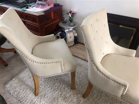 pair  cream coloured studded dining room chairs  thornhill