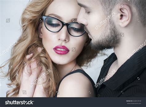 Beautiful Couple Man Hugging A Blond Woman Woman Wearing Eyeglasses