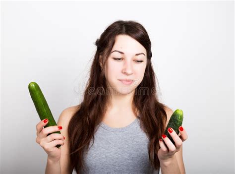 Beautiful Young Woman Eating An Vegetables Selection Small Or Big