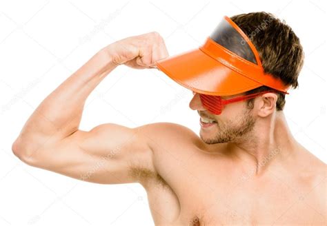 attractive young man flexing bicep muscles stock photo  ailaimages