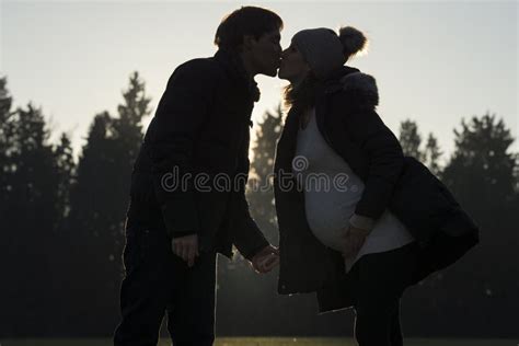 Pregnant Woman Kissing Partner Outdoors Stock Image Image Of Outdoors
