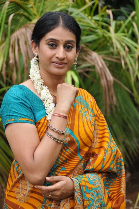 telugu tv serial actress meena in yellow saree picture gallery photos