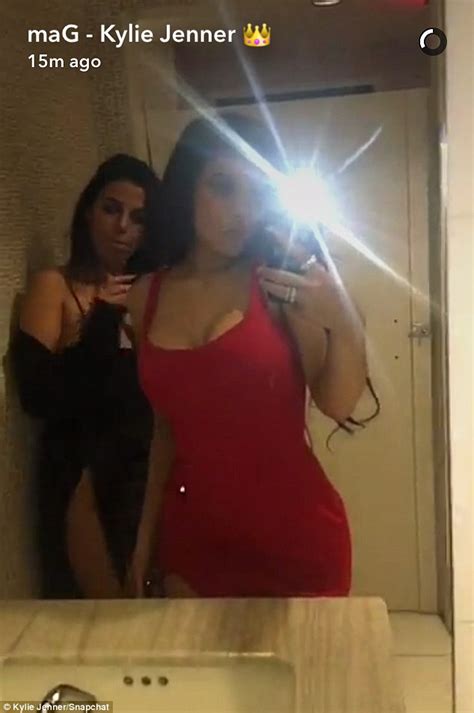 Kylie Jenner Wears Red Dress As She Jumps Into A