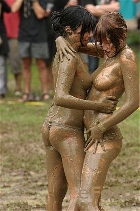 girls having fun in mud redbust