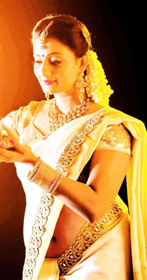 actress in kerala bridal low hip navel saree indian long
