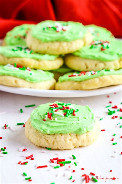 soft and chewy christmas frosted sugar cookies the busy baker