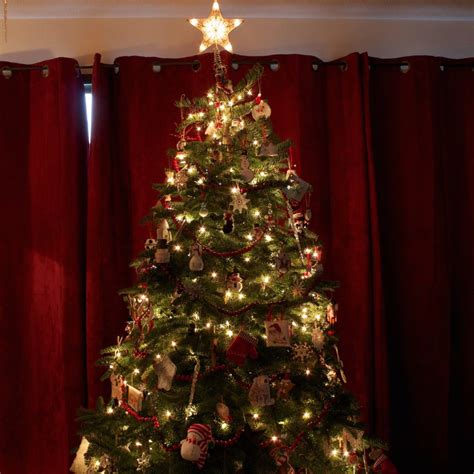 putting lights   christmas tree  frugal christmas