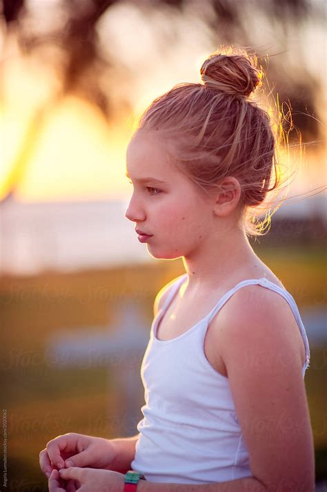 portrait of a pre teenage girl at sunset by stocksy contributor