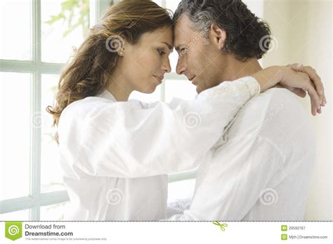 mature couple hugging by garden doors stock image image