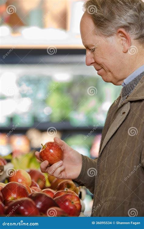 man holding  apple stock photo image  appearance