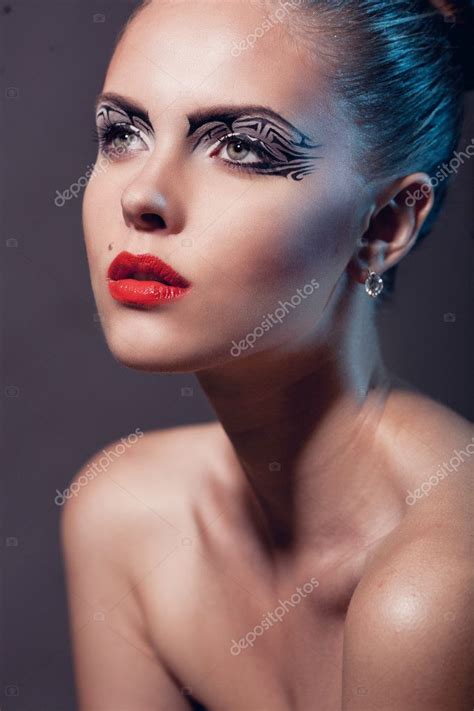 Face Of A Beautiful Woman With Creative Makeup And Red