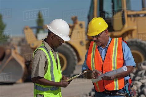 construction workers working  building site stock photo dissolve
