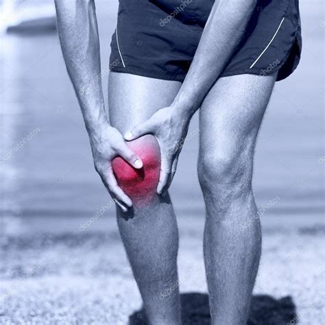 male runner  pain  sprain knee stock photo  maridav