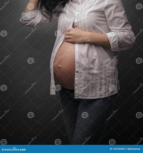 Pregnant Girl With A Bare Belly On Gray Background Stock Image Image