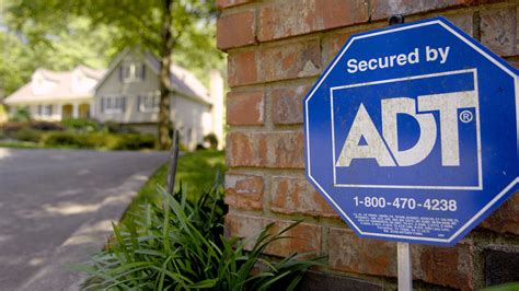 adt agrees   bought  apollo global management    billion deal marketwatch