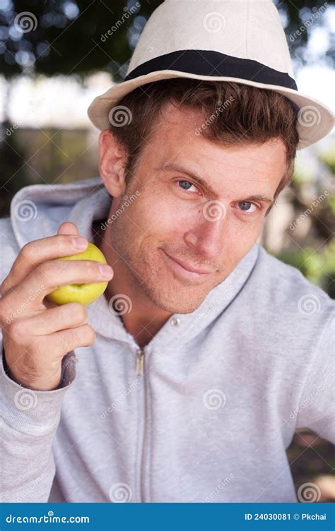 portrait   young man holding apple stock image image  apple handsome