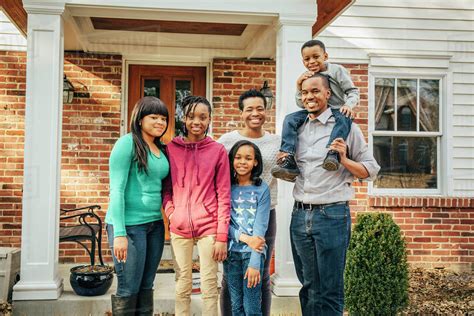 black family smiling  house stock photo dissolve