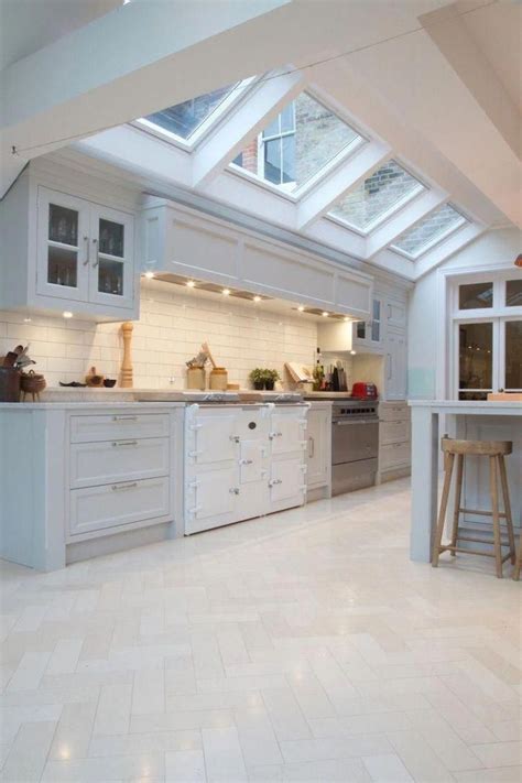 traditional white kitchen  herringbone white tile flooring