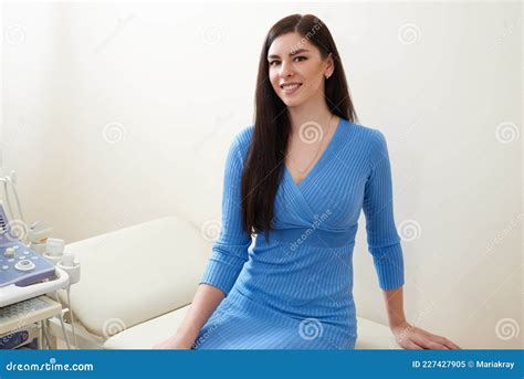 Young Woman Waiting For Gynecologist To Do Ultrasound Scanning In