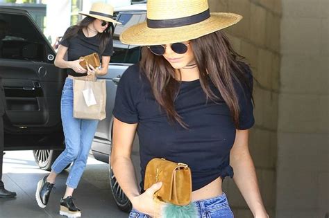 kendall jenner flashes her toned stomach in midriff baring t shirt