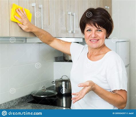 retiree woman cleaning home stock image image  equipment home