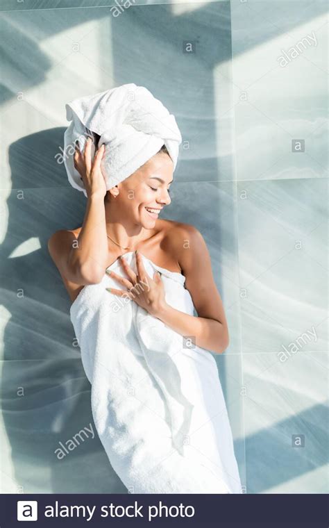 Portrait Of Beautiful Woman Wearing Bathrobe And Towel On Head After