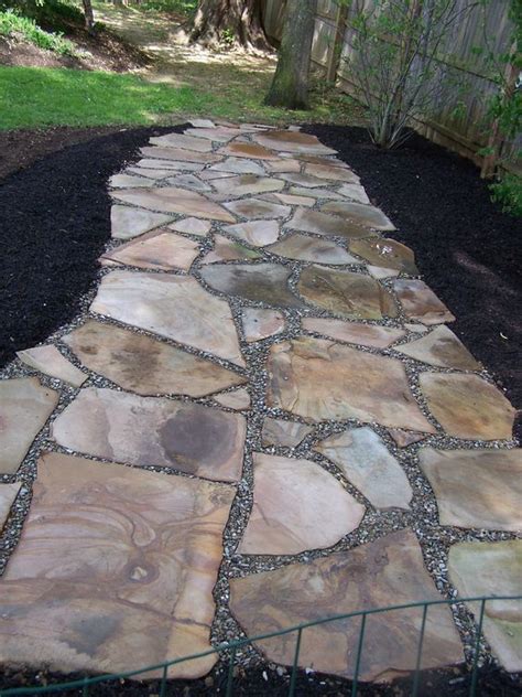 irregular natural stone permeable patio  pea gravel joints