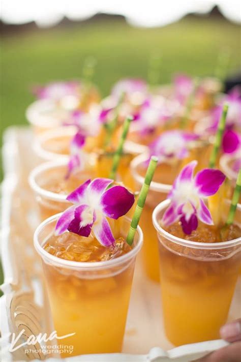 purple orchid wedding refreshing iced drinks with bamboo straws and garnished with purple