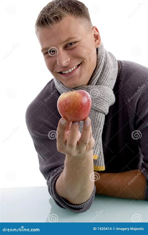portrait  smiling man holding apple stock photo image  cold diet