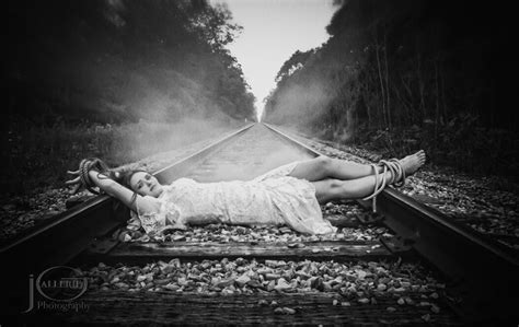 damsel  distress tied   railroad tracks waiting   hero black white photography