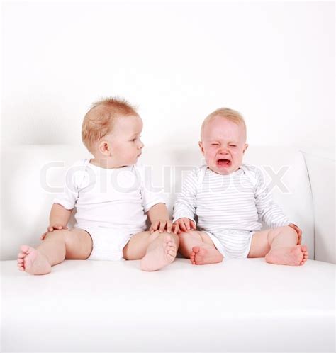 sweet babies    crying stock photo colourbox