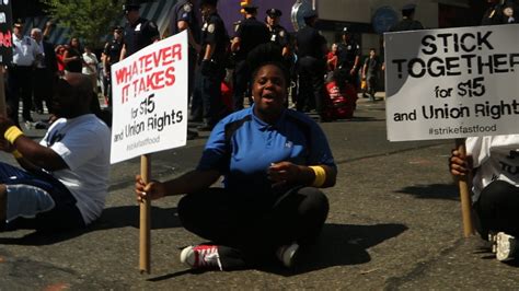 hundreds of fast food workers striking for higher wages are arrested