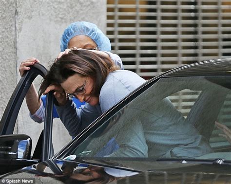bruce jenner leaves a clinic with a bandaged throat after