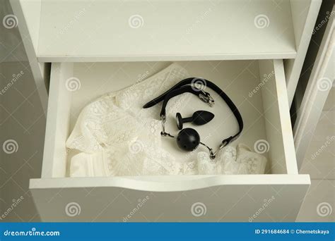 Anal Plug Ball Gag And Women S Underwear In Open Drawer Of Nightstand