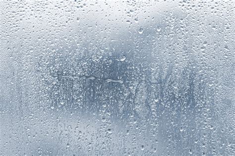 premium photo raindrops condensation on the glass window during