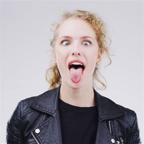 woman sticking out tongue crossing eyes bilder und stockfotos istock
