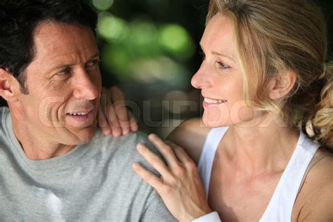 mature fit couple exercising together in the countryside stock image