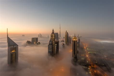 aerial fog cityscape skyscraper united arab emirates man