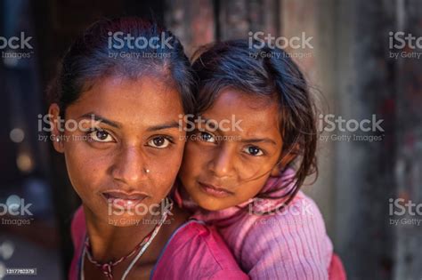 nepali girls holding her little sister durbar square of bhaktapur stock