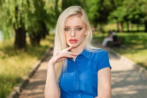 Portrait Of A Beautiful Blonde Girl Outdoors In Summer Stock Image