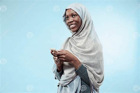 The Beautiful Young Black Muslim Girl Wearing Gray Hijab With A Happy