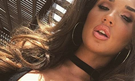 towie s megan mckenna flaunts her perky assets in a plunging black top